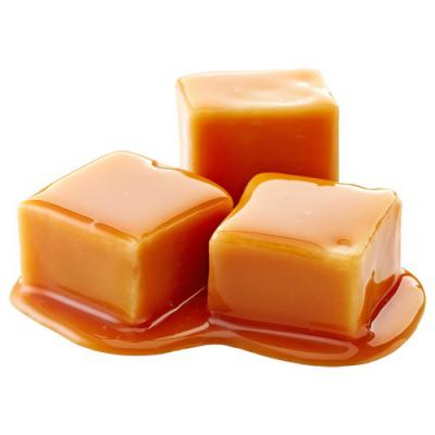 Warm caramel pour on a dark surface — Fragrenza guide to sweet perfumes for men