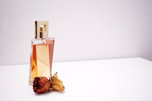 Row of popular viral perfume bottles on pink background