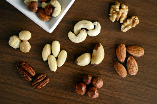 A bowl of pistachios, their earthy green and ivory tones evoking the creamy warmth of pistachio fragrance