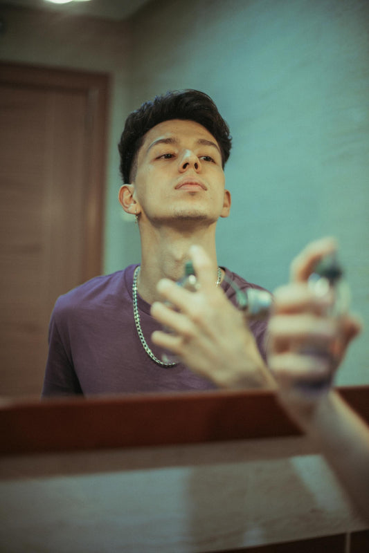 Man spraying cologne — the engaged, knowledgeable men's fragrance audience reshaping the category in 2026
