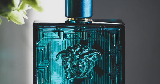 Person delicately applying perfume to their wrist